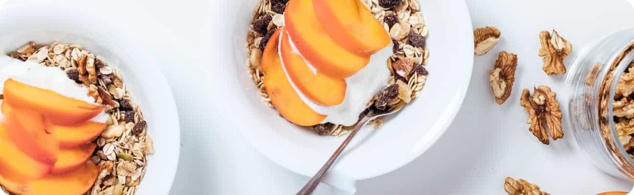 Bowl of cereal topped with fruits